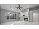 Comfortable living room features a cozy fireplace and natural light at 571 Masalo Pl, Lake Mary, FL 32746