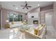Bright living room featuring tile floors, a fireplace, and large windows at 571 Masalo Pl, Lake Mary, FL 32746