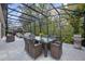 An outdoor dining area on a screened lanai with glass table and seating at 571 Masalo Pl, Lake Mary, FL 32746
