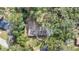 Aerial view of a home surrounded by lush, mature trees, showcasing the property's privacy at 1660 Killean Ct, Apopka, FL 32712