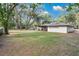 Expansive backyard with mature trees offering ample shade and privacy at 1660 Killean Ct, Apopka, FL 32712
