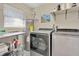 Clean laundry room with washer, dryer, and utility sink at 1660 Killean Ct, Apopka, FL 32712
