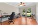 Bright office space with hardwood floors, natural light, and a ceiling fan at 1660 Killean Ct, Apopka, FL 32712