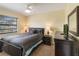 Spacious bedroom with comfortable bed and TV at 2007 Disney Mgm Studio Ct, Kissimmee, FL 34746