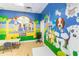 room with tables, chairs, and dog-themed mural at 2007 Disney Mgm Studio Ct, Kissimmee, FL 34746