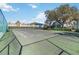 Tennis court with net, fencing, and seating at 2007 Disney Mgm Studio Ct, Kissimmee, FL 34746