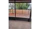 View from the covered porch of a fenced backyard and mulch area at the rear of the property at 4530 Brook Hollow Cir, Winter Springs, FL 32708