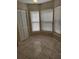 Bright dining area featuring tile flooring, three windows with blinds and a closet for storage at 4530 Brook Hollow Cir, Winter Springs, FL 32708