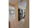 Spacious kitchen with tile floors, stainless steel refrigerator, and view into adjacent living area at 4530 Brook Hollow Cir, Winter Springs, FL 32708