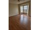 Inviting living room featuring wood floors, a ceiling fan, and a large bay window at 4530 Brook Hollow Cir, Winter Springs, FL 32708