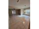 Spacious living room featuring tiled floors, French doors and modern hanging lights at 4530 Brook Hollow Cir, Winter Springs, FL 32708