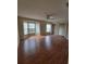 Expansive living room with hardwood floors, a bay window, and plenty of natural light at 4530 Brook Hollow Cir, Winter Springs, FL 32708
