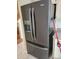 Close up of modern, black stainless steel refrigerator with water and ice dispenser at 4530 Brook Hollow Cir, Winter Springs, FL 32708
