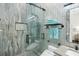Spa-like bathroom featuring a glass shower and elegant tile work at 7811 Skiing Way, Winter Garden, FL 34787