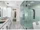 Spa-like bathroom with walk-in shower and soaking tub at 7811 Skiing Way, Winter Garden, FL 34787