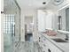 Elegant bathroom with double sinks and a large shower at 7811 Skiing Way, Winter Garden, FL 34787
