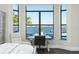 Bedroom with lake view and built-in workspace at 7811 Skiing Way, Winter Garden, FL 34787