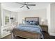 Spacious bedroom with a king-size bed and chaise lounge at 7811 Skiing Way, Winter Garden, FL 34787