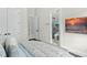 Serene bedroom with ensuite bathroom and large TV at 7811 Skiing Way, Winter Garden, FL 34787