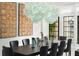 Elegant dining room with a large table and statement lighting at 7811 Skiing Way, Winter Garden, FL 34787