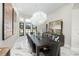 Elegant dining room features a large table and unique light fixtures at 7811 Skiing Way, Winter Garden, FL 34787