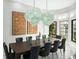 Elegant dining room with a large table and statement lighting at 7811 Skiing Way, Winter Garden, FL 34787