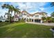 Luxury home with manicured landscaping and a large driveway at 7811 Skiing Way, Winter Garden, FL 34787
