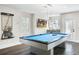 Game room with a pool table and plenty of space for entertainment at 7811 Skiing Way, Winter Garden, FL 34787