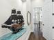Bright hallway with hardwood floors and decorative ship model at 7811 Skiing Way, Winter Garden, FL 34787