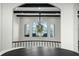 Elegant hallway with a stunning chandelier and lake view at 7811 Skiing Way, Winter Garden, FL 34787