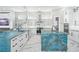 Modern kitchen with two islands and blue quartz countertops at 7811 Skiing Way, Winter Garden, FL 34787