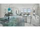 Gourmet kitchen boasts expansive island with stunning blue quartz countertops at 7811 Skiing Way, Winter Garden, FL 34787