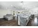 Modern kitchen with expansive island, stainless steel appliances, and breakfast bar at 7811 Skiing Way, Winter Garden, FL 34787