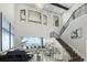 Grand living room boasts high ceilings,water views, and a stunning chandelier at 7811 Skiing Way, Winter Garden, FL 34787