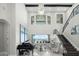 Grand living room boasts high ceilings,water views, and a stunning chandelier at 7811 Skiing Way, Winter Garden, FL 34787