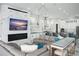 Spacious living room with sectional sofa and large TV at 7811 Skiing Way, Winter Garden, FL 34787