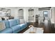 Spacious living room with hardwood floors, comfy seating, and lake views at 7811 Skiing Way, Winter Garden, FL 34787