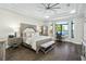 Luxurious main bedroom with water views and sitting area at 7811 Skiing Way, Winter Garden, FL 34787