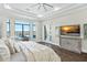 Spacious main bedroom with water views and large TV at 7811 Skiing Way, Winter Garden, FL 34787