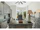 Home office with built-in cabinetry and water views at 7811 Skiing Way, Winter Garden, FL 34787