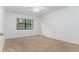 Bright bedroom with a ceiling fan and large window at 104 Coventry Ln, Haines City, FL 33844