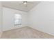 Bright bedroom with neutral carpet and ceiling fan, offering a comfortable living space at 14216 Boca Key Dr, Orlando, FL 32824