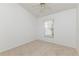 Bedroom with neutral carpet, ceiling fan, and window for natural light at 14216 Boca Key Dr, Orlando, FL 32824