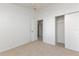 Carpeted bedroom featuring an open closet, ceiling fan, and neutral walls at 14216 Boca Key Dr, Orlando, FL 32824