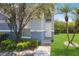 Charming home featuring a well-maintained lawn, walkway, and beautiful landscaping at 14216 Boca Key Dr, Orlando, FL 32824