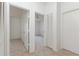 Hallway leading to carpeted bedrooms with fan and closet, offering spacious living at 14216 Boca Key Dr, Orlando, FL 32824