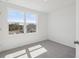 Carpeted bedroom with a large window offering a view of a neighboring home at 2378 Broadbrook Dr, St Cloud, FL 34771