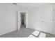 Bedroom with neutral carpet, closet, and doorway view into an attached bathroom at 2378 Broadbrook Dr, St Cloud, FL 34771
