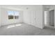 Upstairs bedroom with carpet, double-door closet and large window overlooking the yard at 2378 Broadbrook Dr, St Cloud, FL 34771