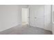 Bright bedroom featuring neutral carpet and a white door leading to a walk-in closet at 2378 Broadbrook Dr, St Cloud, FL 34771